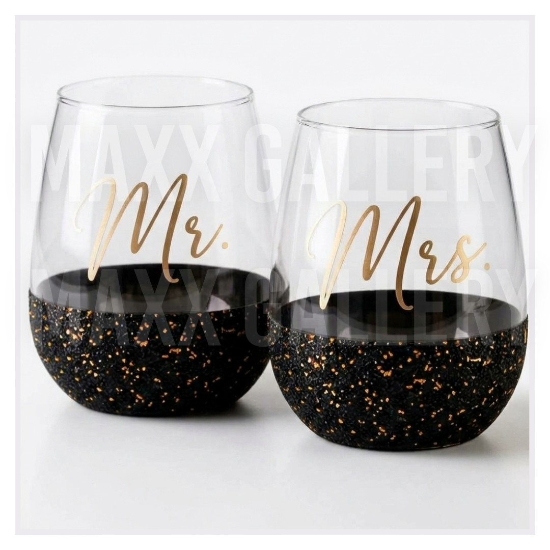 Set of 2 Mr. and Mrs. stemless wine glasses in gold script with black and gold glitter bases