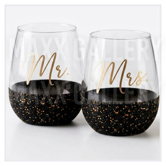 Set of 2 Mr. and Mrs. stemless wine glasses in gold script with black and gold glitter bases