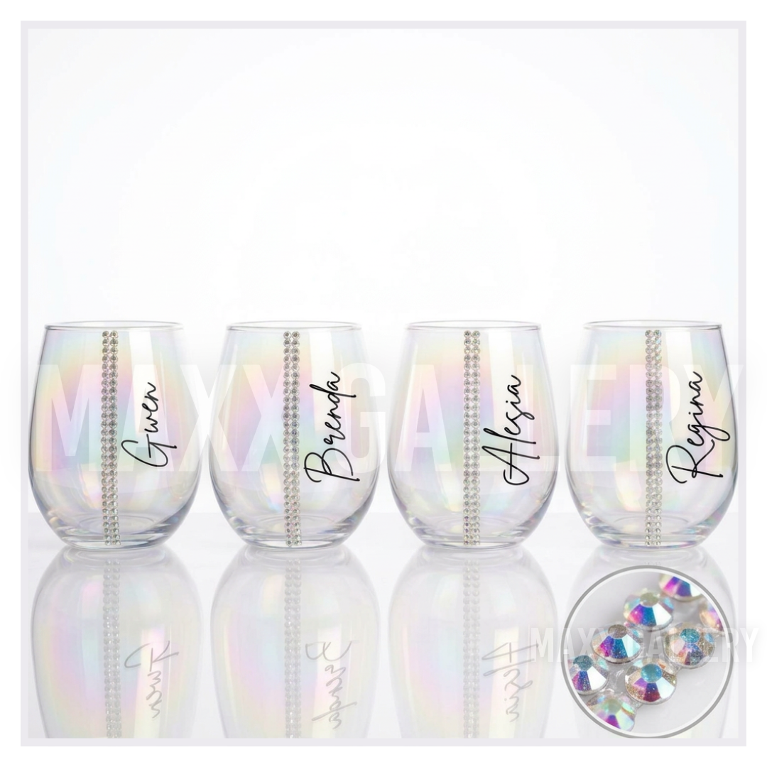 Personalized iridescent stemless wine glass with the name Gwen in black script beside a single row of AB glass crystals ORLANDO NAIL TECH MAXX GALLERY HAND MADE GLASS WARE DRINK WARE CHRISTMAS GIFT BRIDESMAID GIFT BIRTHDAY GIFT ETSY TIKTOK FALL 2026 IRRIDESCENT HOLOGRAPHIC MAXIMIALIST ART